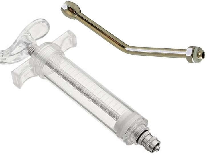 Nylon plastic syringe with nozzle.